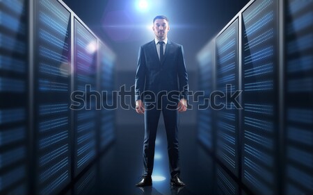 Stock photo: businessman over server room background