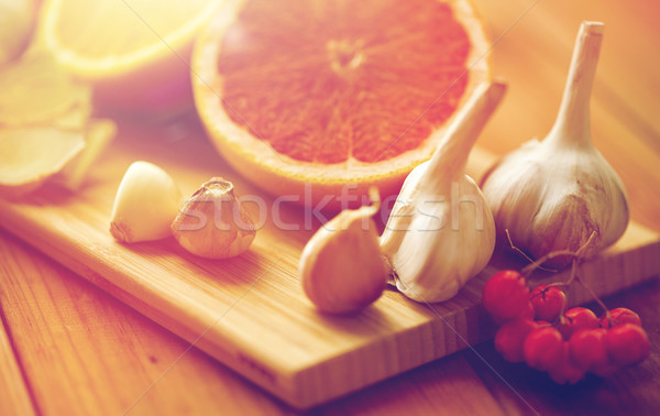 citrus, ginger, garlic and rowanberry on wood Stock photo © dolgachov
