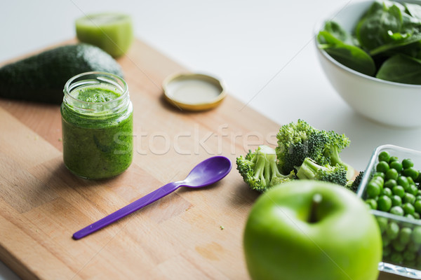jar with puree or baby food on wooden board Stock photo © dolgachov