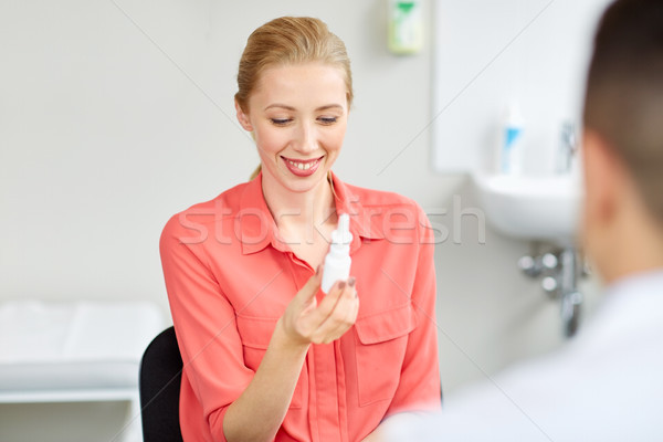 woman with nasal spray and doctor at hospital Stock photo © dolgachov