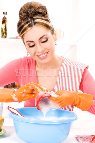 housewife washing dish Stock photo © dolgachov