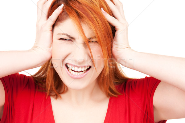 Stock photo: unhappy redhead woman