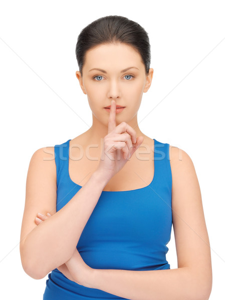 woman making a hush gesture Stock photo © dolgachov