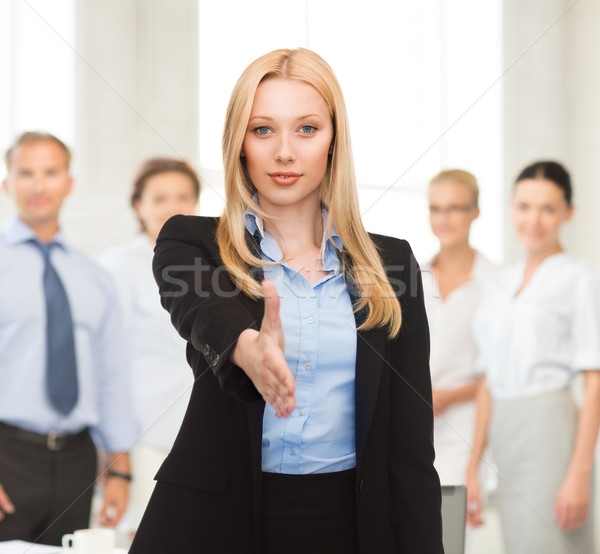 Nő nyitva kéz kész kézfogás iroda Stock fotó © dolgachov