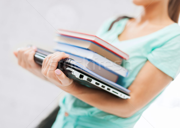 student with books, computer and folders Stock photo © dolgachov
