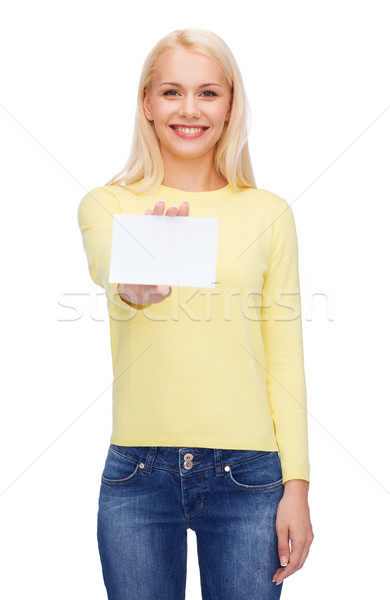 smiling girl with blank business or name card Stock photo © dolgachov