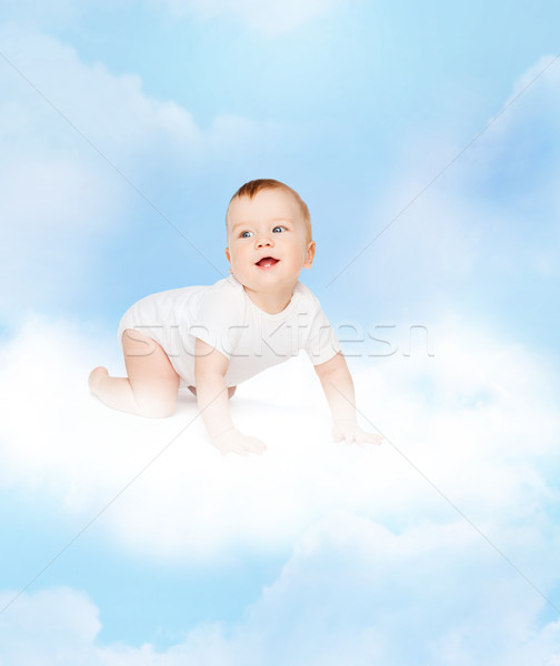 crawling smiling baby looking up Stock photo © dolgachov