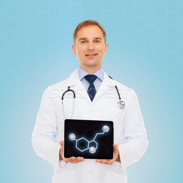 smiling male doctor showing tablet pc screen Stock photo © dolgachov