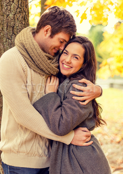 smiling couple hugging in autumn park Stock photo © dolgachov