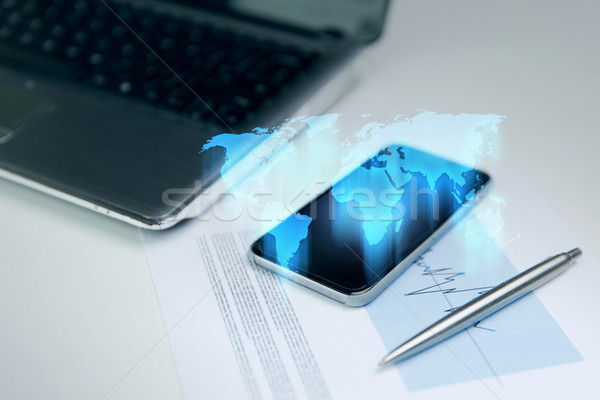 Smartphone wereldkaart hologram business technologie Stockfoto © dolgachov
