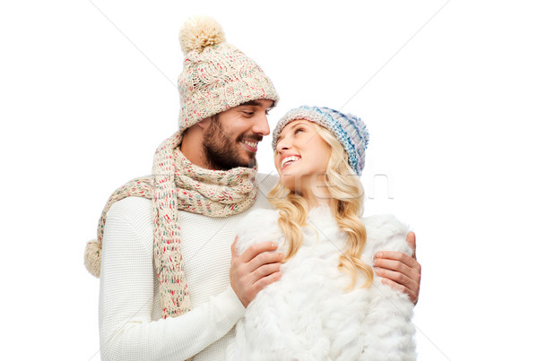 smiling couple in winter clothes hugging Stock photo © dolgachov