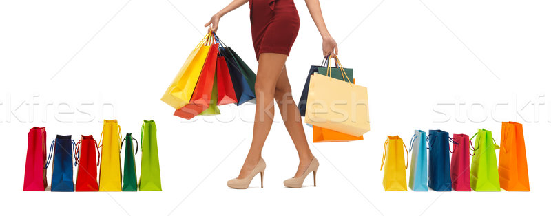 close up of woman on high heels with shopping bags Stock photo © dolgachov