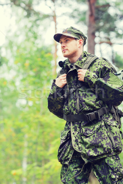 young soldier with backpack in forest Stock photo © dolgachov