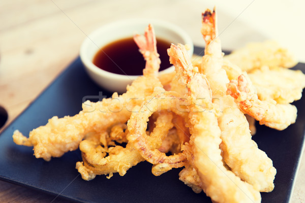 close up of deep-fried shrimps and soy sauce Stock photo © dolgachov