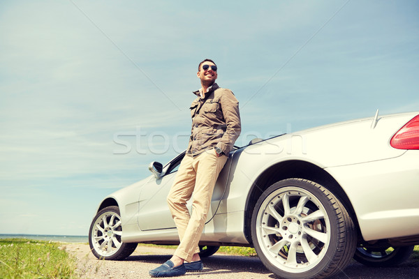 happy man near cabriolet car outdoors Stock photo © dolgachov