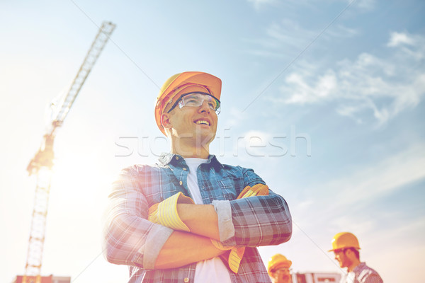 Grupo sorridente construtores ao ar livre negócio edifício Foto stock © dolgachov