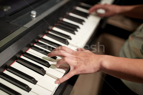 close up of hands playing piano Stock photo © dolgachov