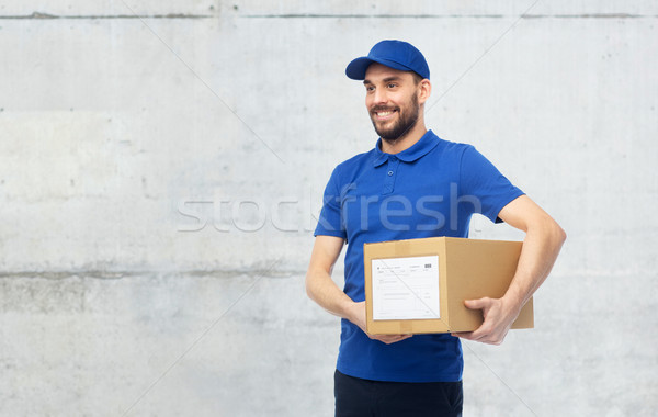 happy delivery man with parcel box Stock photo © dolgachov