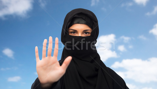 muslim woman in hijab showing stop sign Stock photo © dolgachov