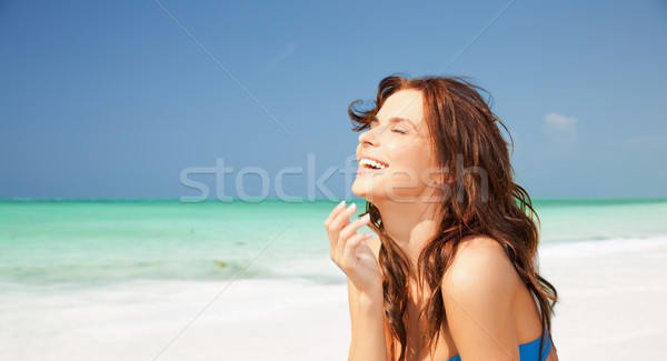 happy smiling young woman on tropical beach Stock photo © dolgachov