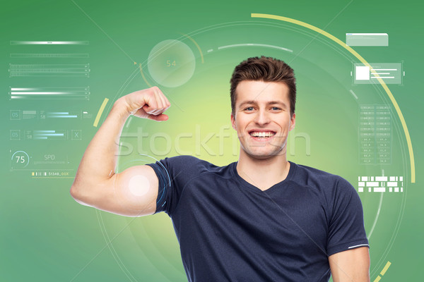 sportive man showing bicep power Stock photo © dolgachov