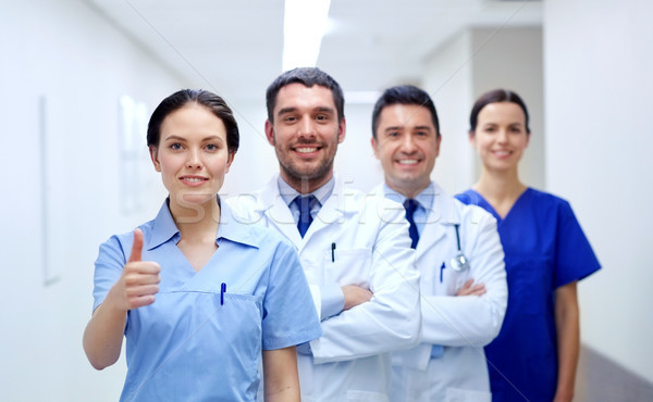 medics or doctors at hospital showing thumbs up Stock photo © dolgachov