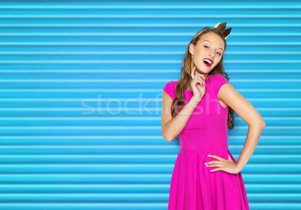 happy young woman or teen girl in pink dress Stock photo © dolgachov