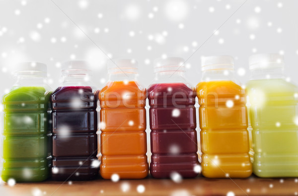 bottles with different fruit or vegetable juices Stock photo © dolgachov