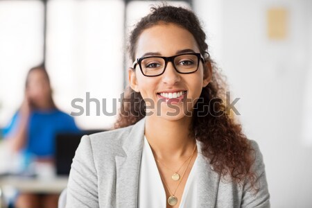 close up of smiling middle aged woman in glasses Stock photo © dolgachov