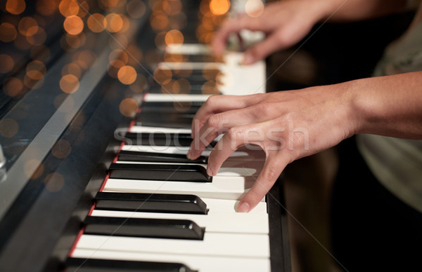 close up of hands playing piano Stock photo © dolgachov