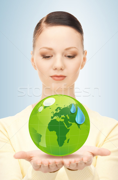 Femme vert monde mains [[stock_photo]] © dolgachov