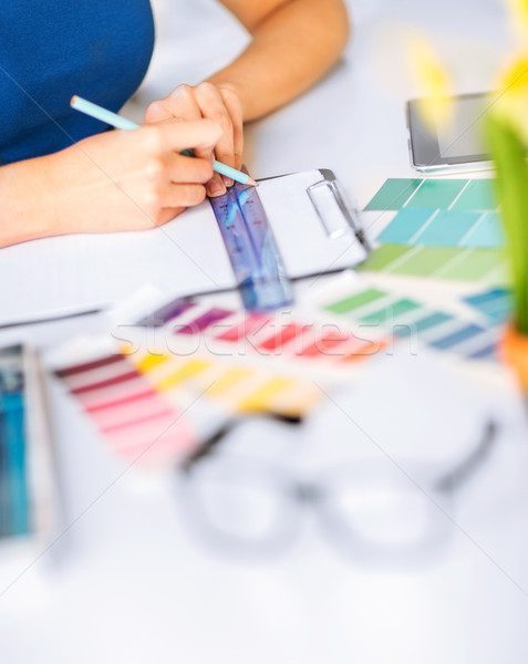 woman working with color samples for selection Stock photo © dolgachov