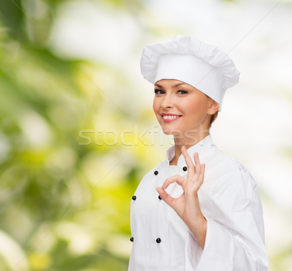 Lächelnd weiblichen Küchenchef Handzeichen Stock foto © dolgachov