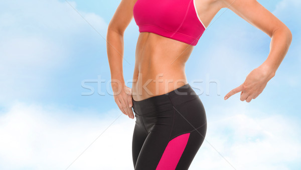 Kobieta wskazując fitness Zdjęcia stock © dolgachov