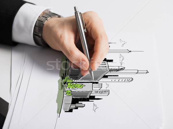 close up of male hand with pen drawing graph Stock photo © dolgachov