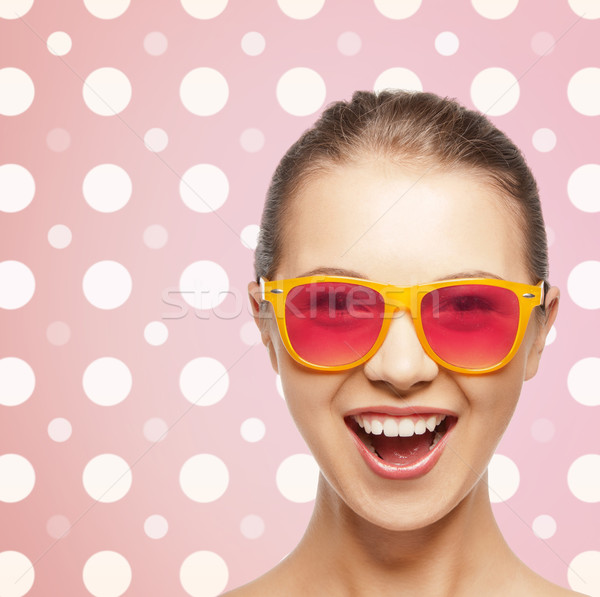 happy laughing teenage girl in pink shades Stock photo © dolgachov