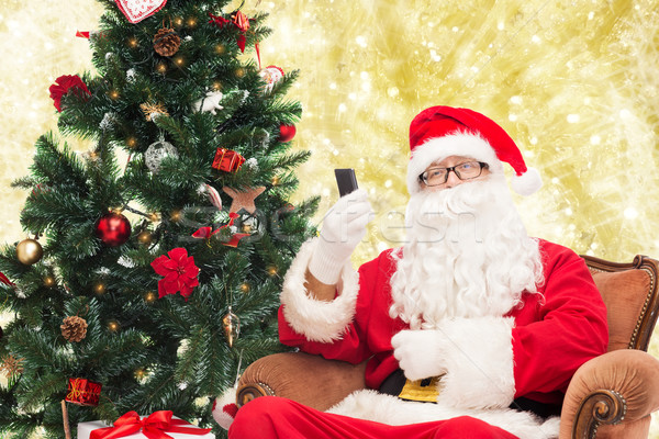 Smartphone arbre de noël vacances technologie personnes [[stock_photo]] © dolgachov