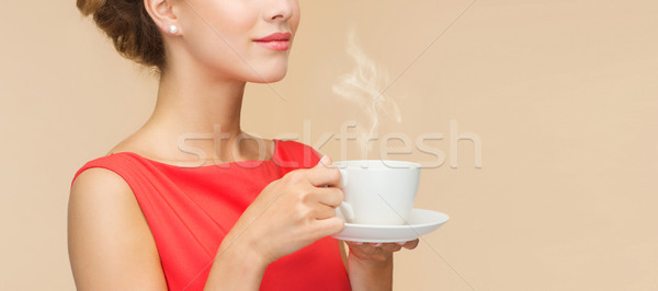 улыбающаяся женщина красное платье Кубок кофе отдыха счастье Сток-фото © dolgachov