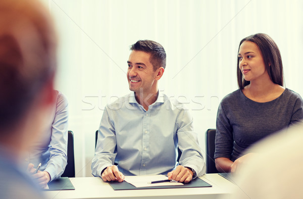 Grupo sonriendo reunión oficina gente de negocios Foto stock © dolgachov