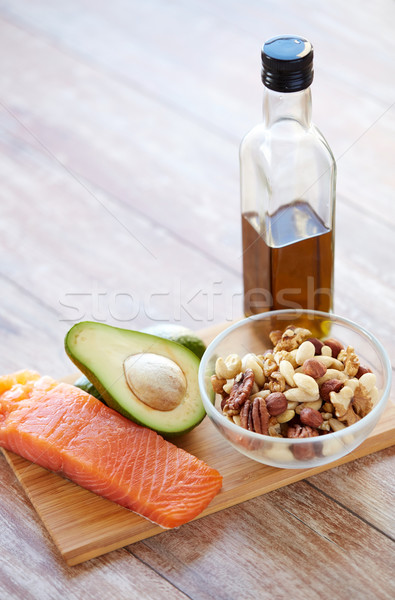 close up of food and olive oil bottle on table Stock photo © dolgachov