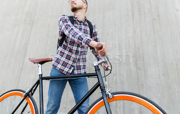 hipster man with fixed gear bike and backpack Stock photo © dolgachov