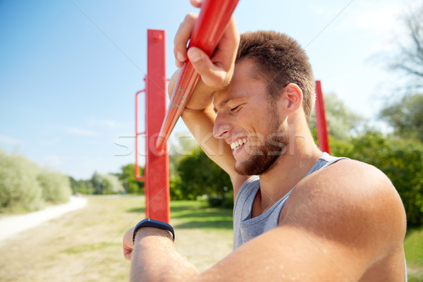 man with heart-rate watch exercising outdoors Stock photo © dolgachov