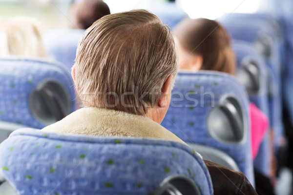 close up of senior man sitting in travel bus Stock photo © dolgachov