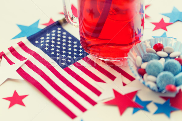 juice glass and american flag on independence day Stock photo © dolgachov