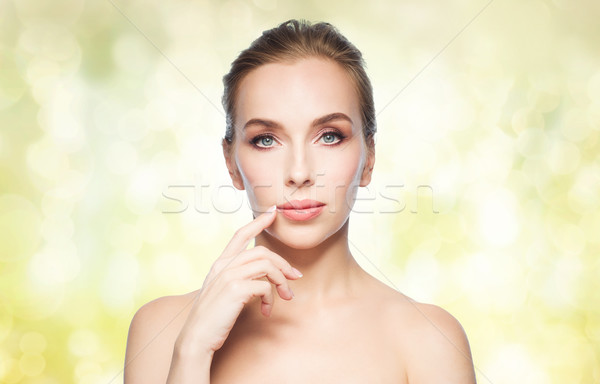 beautiful young woman showing her lips Stock photo © dolgachov