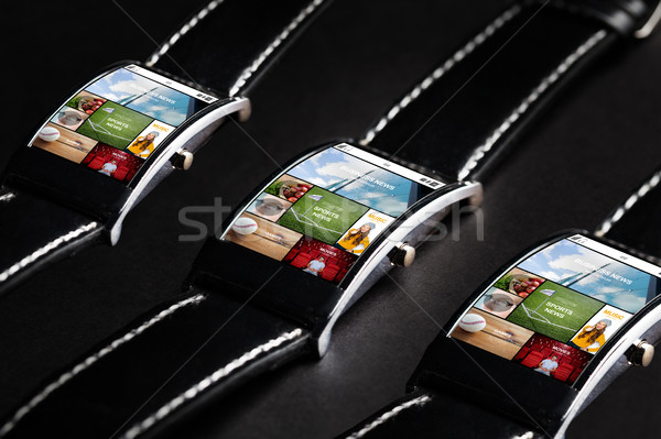 close up of smart watches with news application Stock photo © dolgachov