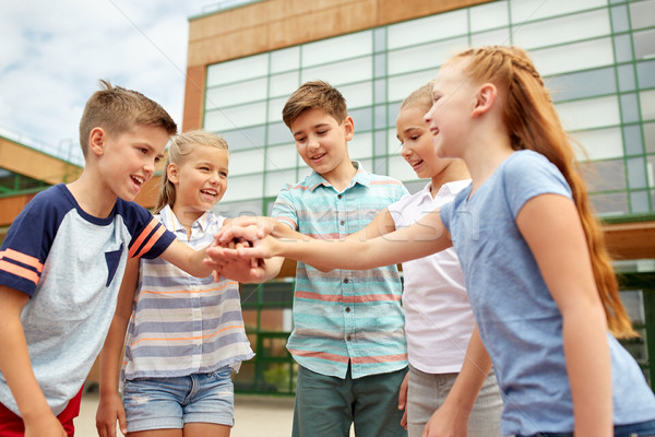 Groupe heureux école élémentaire élèves primaire éducation [[stock_photo]] © dolgachov