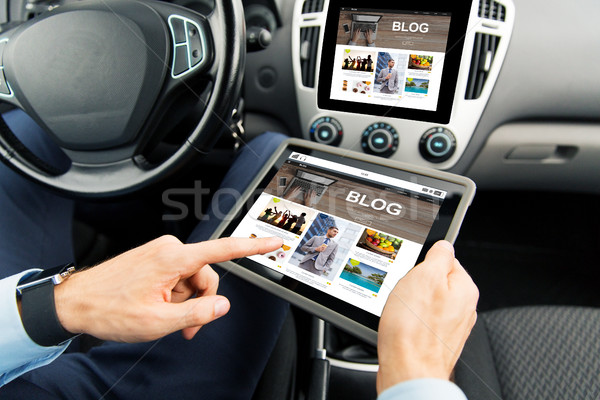 close up of man with tablet pc in car Stock photo © dolgachov