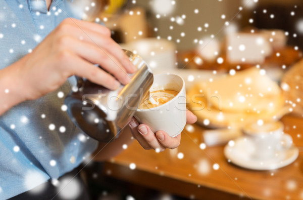 close up of woman making coffee at shop or cafe Stock photo © dolgachov