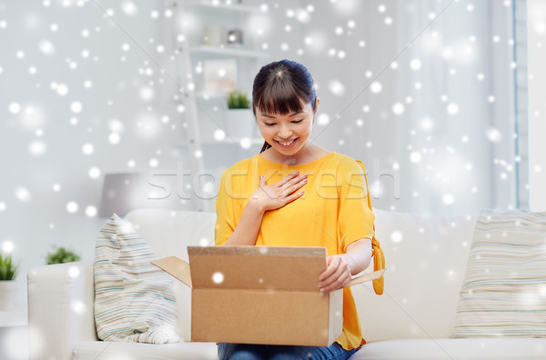 happy asian young woman with parcel box at home Stock photo © dolgachov